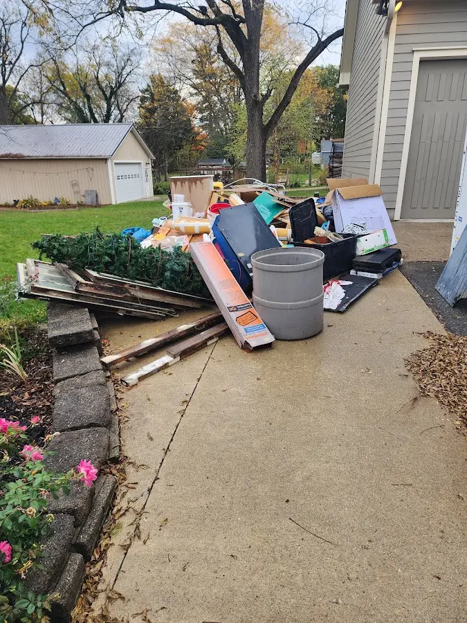 Dumpster being loaded with debris for Estate Cleanout Dumpster Rental in Mount Vernon